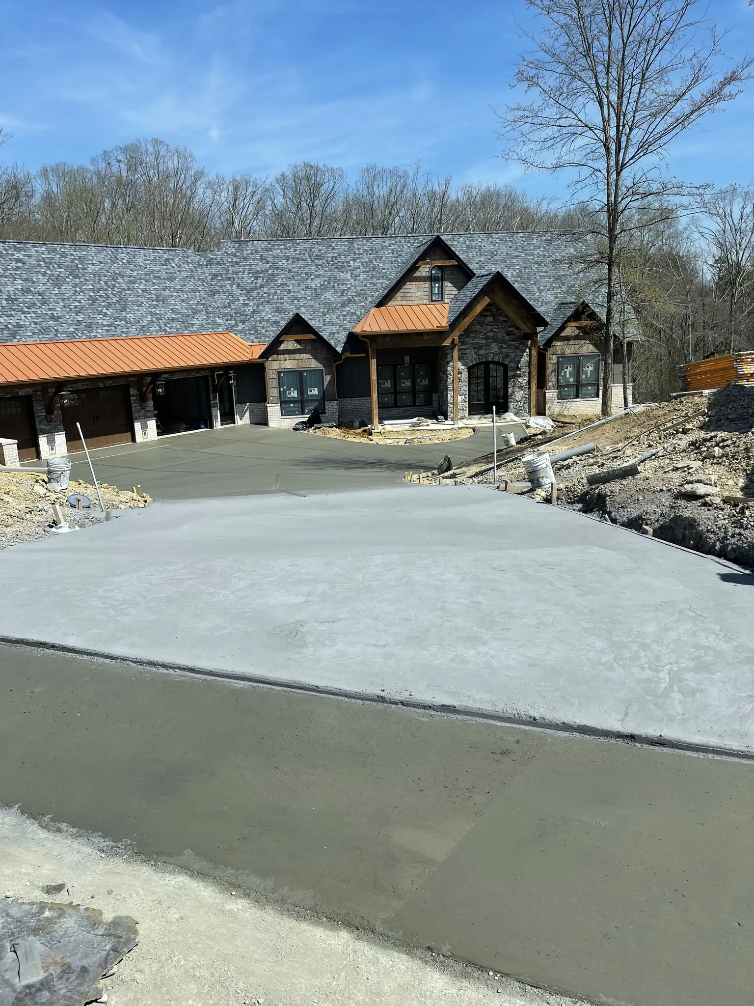 Wide concrete driveway freshly poured at a large new home near Knoxville, Tennessee