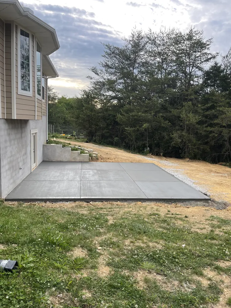 Concrete patio slab poured beside a house in Knoxville, Tennessee