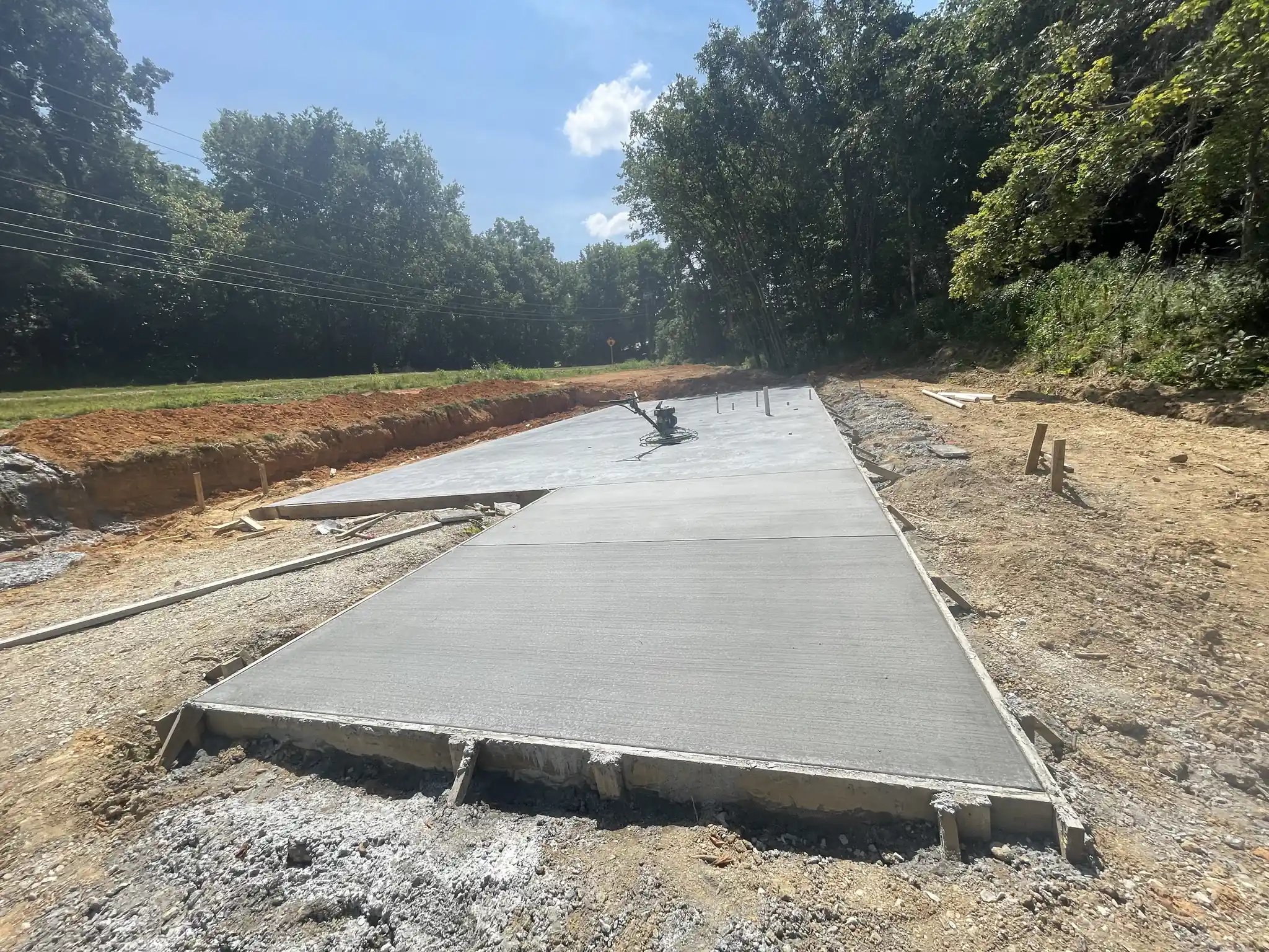 Finished concrete pad poured on a cleared lot near Knoxville, Tennessee