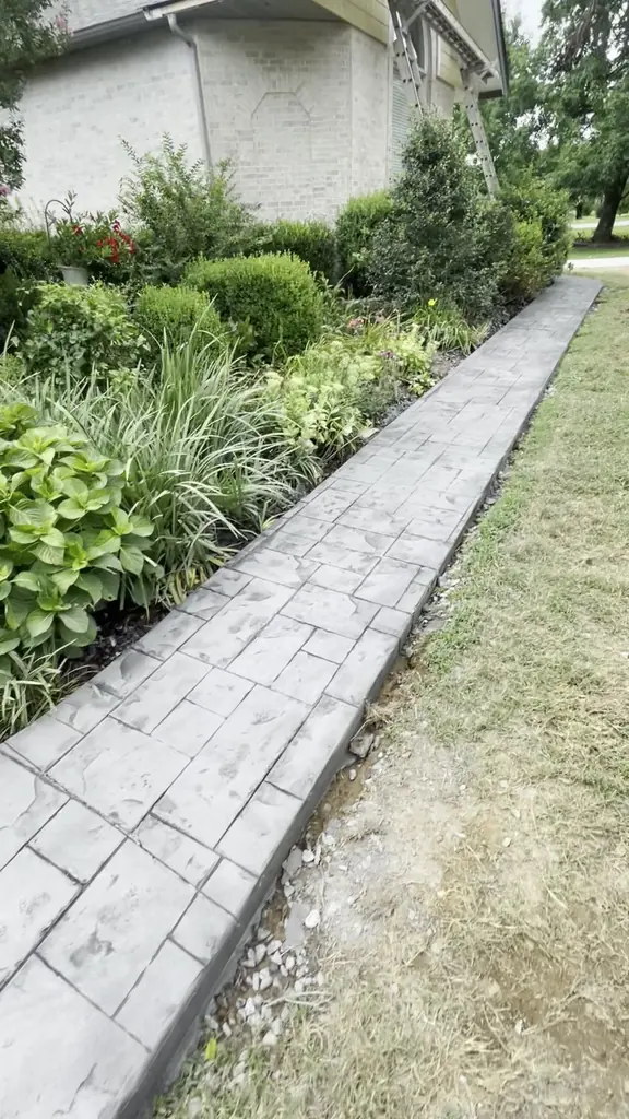 Stamped concrete border finished along a front walkway in Knoxville, Tennessee
